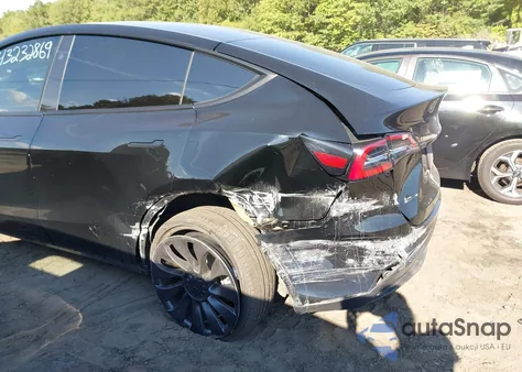 2023 Tesla Model Y Awd/Long Range Dual Motor All-Wheel Drive z USA, uszkodzony, nr VIN 7SAYGDEE9PF880253